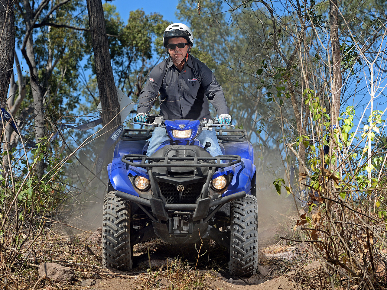 Yamaha Kodiak 700 EPS being ridden in a forest