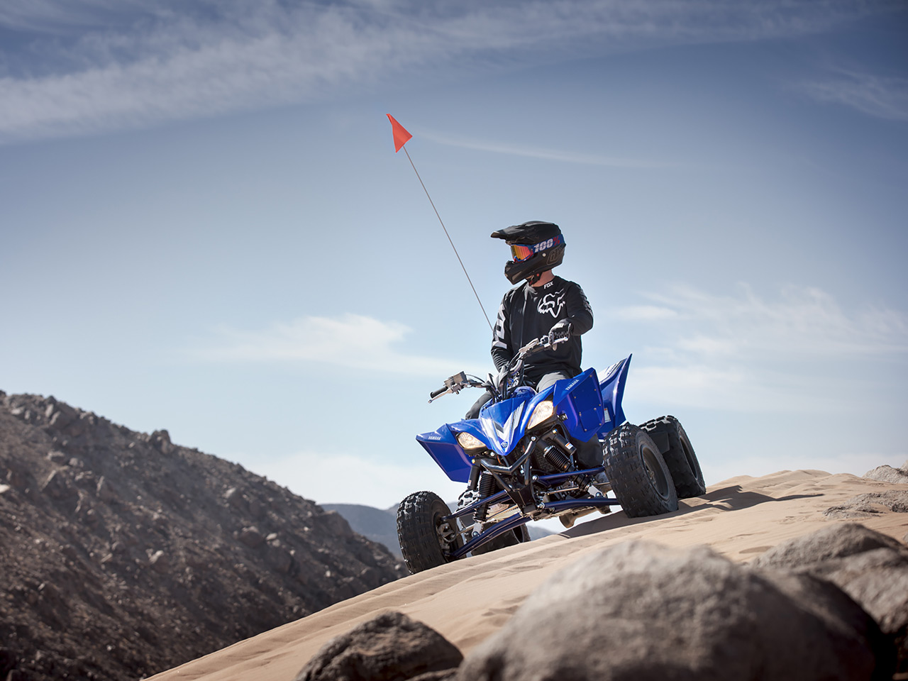 Yamaha YFZ450R in team yamaha blue colour , being ridden in the desert