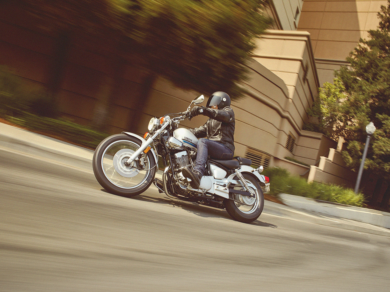 Yamaha XV250 motorcycle riding on the road