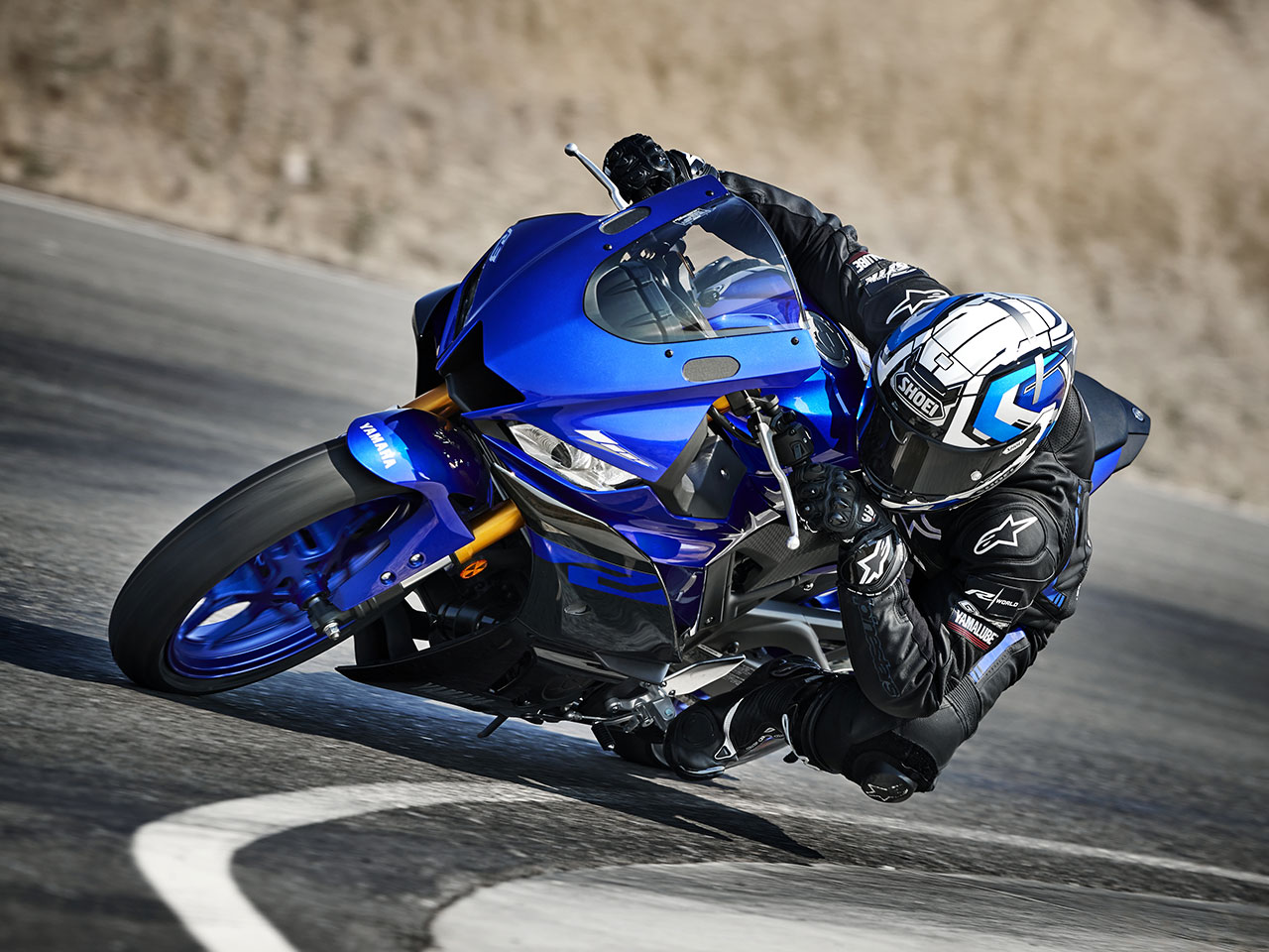 Yamaha YZF-R3 in yamaha blu colour being ridden on road